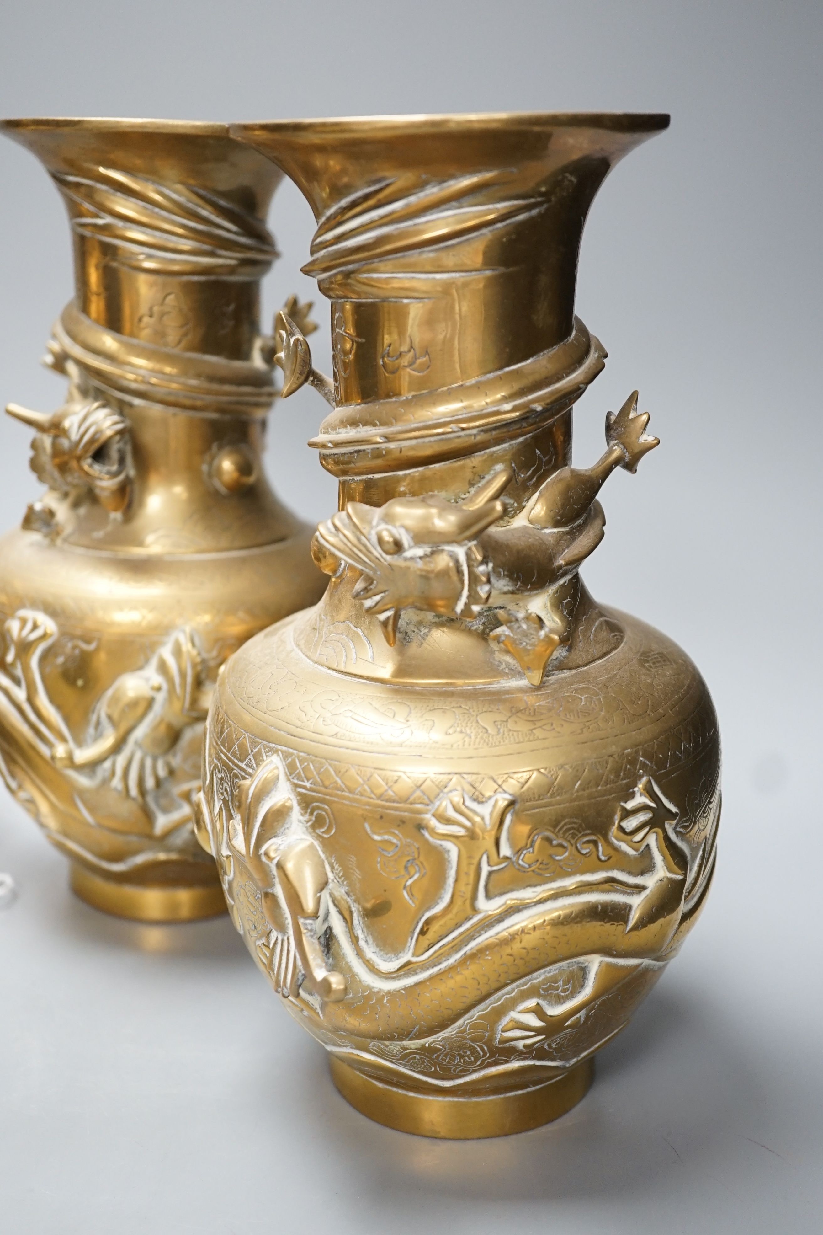 A pair of Chinese brass dragon vases, 26cm, together with two similar incense burners, tallest 30cm high